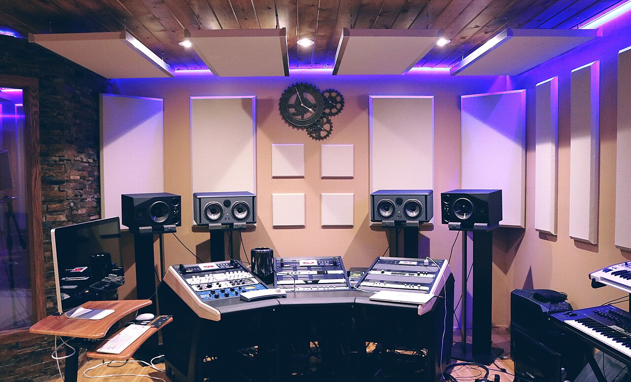 Professional recording studio console with audio monitors and production equipment