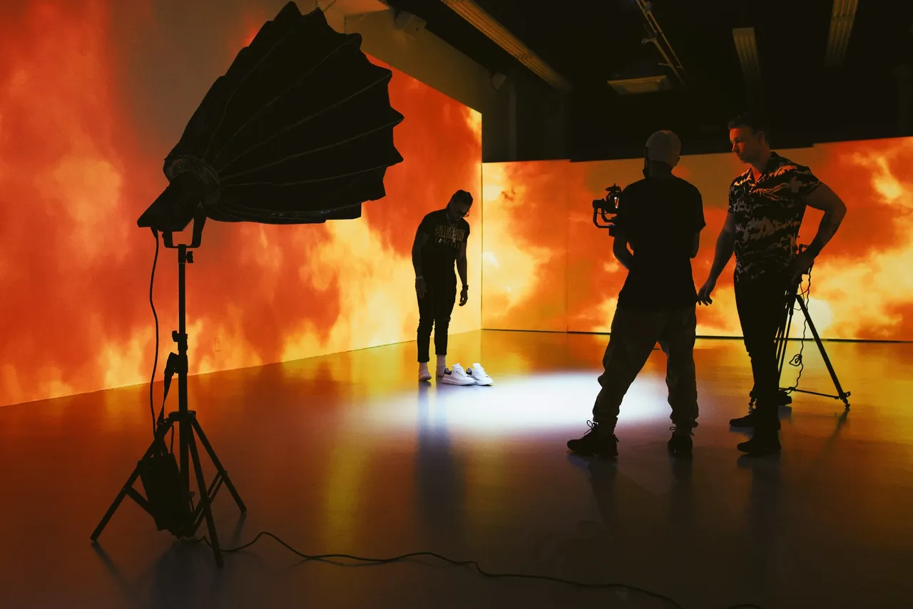 Film and studio production setup with lights and camera crew